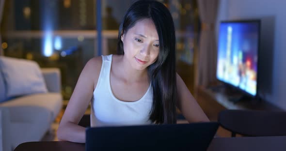 Woman work on laptop computer at home alt