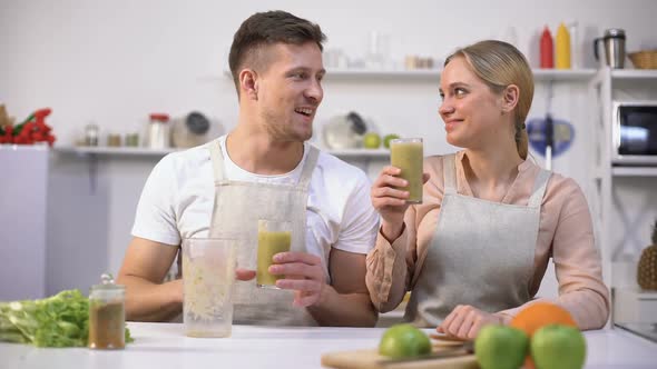 Young Healthy Couple Drinking Fresh Spirulina Smoothie, Vitamins and Minerals alt