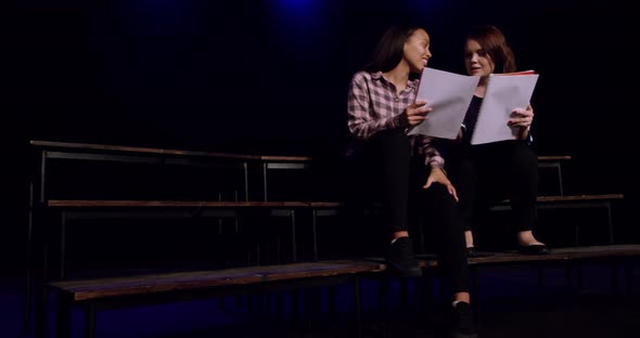 Teenagers rehearsing in a theatre alt