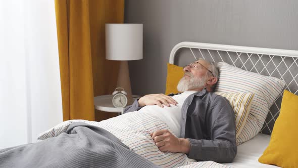 Mature Aged Man Ill Feel Bad Lying on Bed at Home Alone
