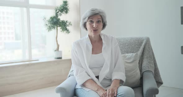 Happy Older Citizen Looking at Webcamera Speaking at Job Interview alt