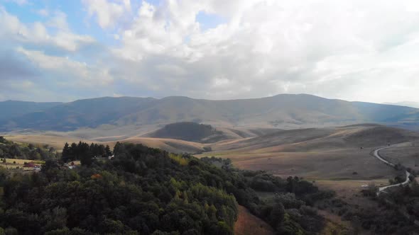 Aerial View of Green Hills of Pester Plateau Mountain Region in Western Serbia on Summer Day Drone