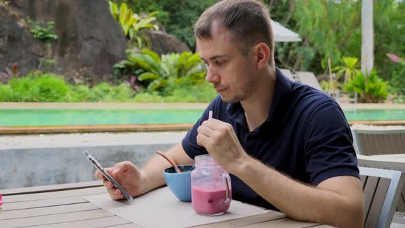 Young Male Attentively Read Social Media News Feed Check Mail in Smartphone alt