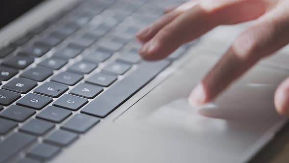 Man is Pinching and Zooming on Touchpad