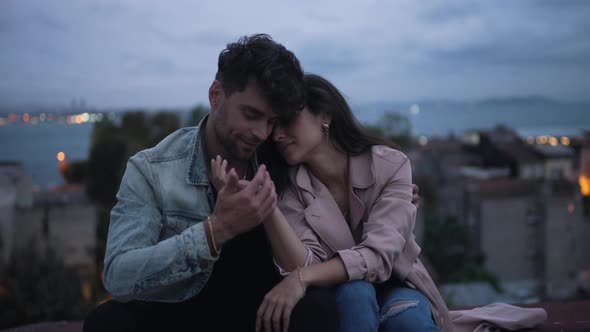 Couple Hugging in the Evening City alt