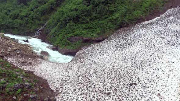 River Flowing Under the Avalanche Mass alt