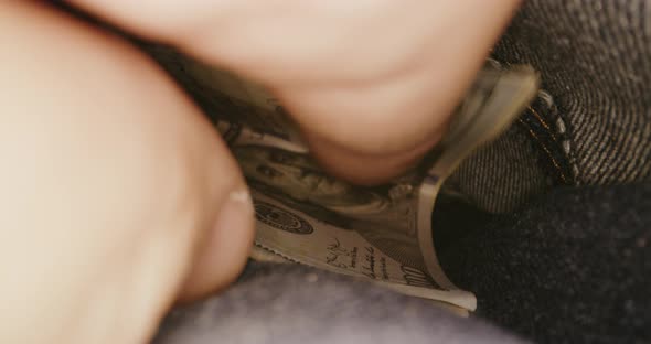 Money Being Taken Out of Pocket alt