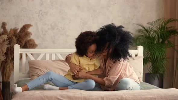 African American Woman and Girl Have Fun Playing and Laughing Happily alt