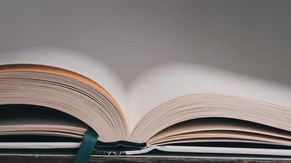 Turning Pages of a Book CloseUp Slow Motion alt