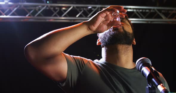 Singer performing on stage alt