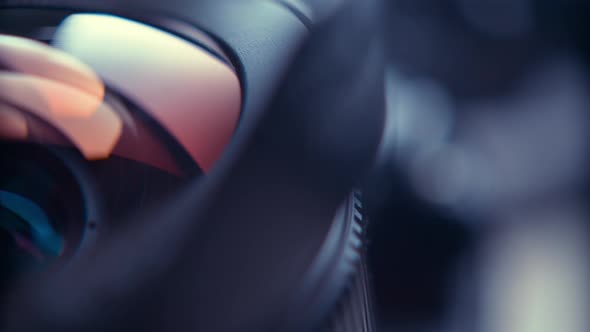 the lens of a movie camera or photo camera is shot in close-up alt