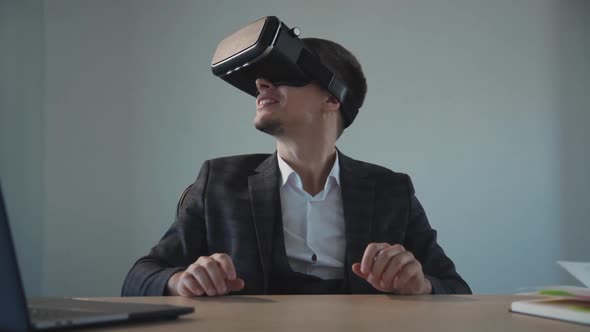 Adult Man Spending Time in Cyber Space in Virtual Reality Glasse