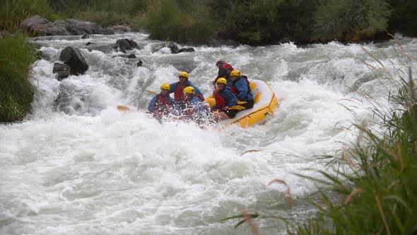 Super slow motion shot of group of people white water rafting, shot on Phantom Flex 4K