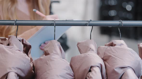 Clothing Store Small Business Unknown Female Merchandising Professional Write in Tablet Paper Create alt