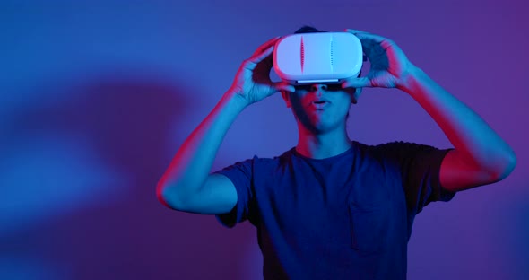 Man looking though VR device alt
