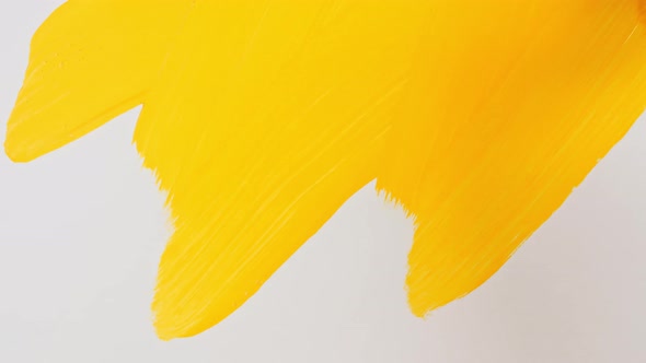 Abstract Brushstrokes of Yellow Paint Brush Applied Isolated on a White Background alt