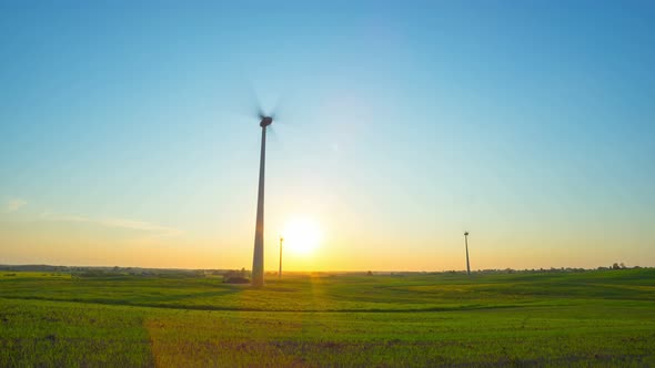 Wind Turbines in the Field and Sunset alt