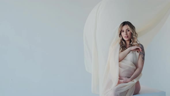 Pregnant Girl Holding Maternity Tummy and Waiting For Childbirth alt