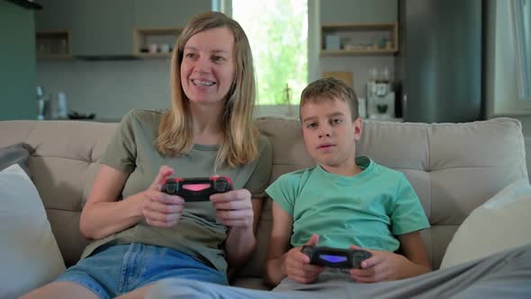 Boy Play Video Game with His Father alt