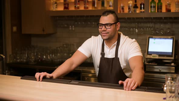 The bartender refuses a drink to a young man who is under eighteen years old alt