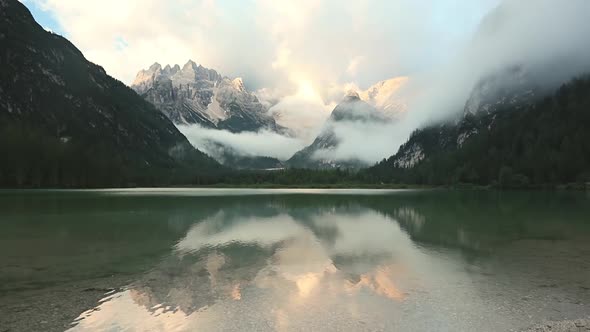Lake in the Mountains and Fog Over the Peaks