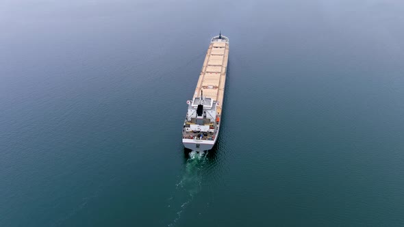 High quality, 4K, top down, aerial view of a cargo ship navigating the St Lawrence Seaway, Canada.
