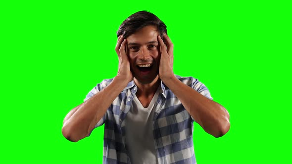 Front view of Caucasian man surprising with green screen alt