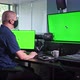 Caucasian man working in video edit suite with multiple screens, chroma key - VideoHive Item for Sale