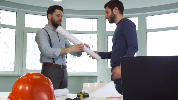 Two Architects Shake Hands at the Office