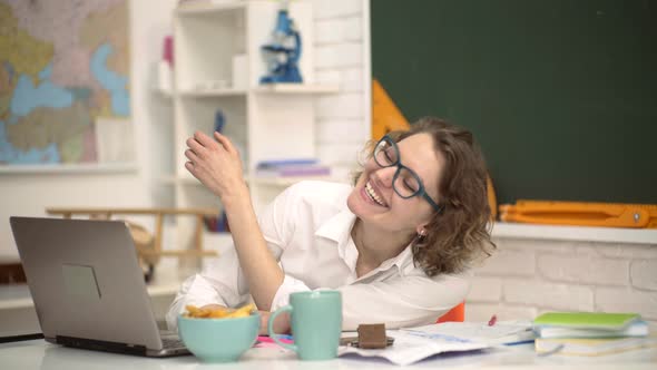 Portrait of Creative Young Smiling Female Student in Glasses. World Teachers Day. Young Happy alt