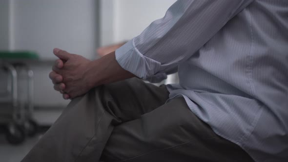 Elder Asian Man Worry Hands While Waiting For Family At Hospital Unrecognize People