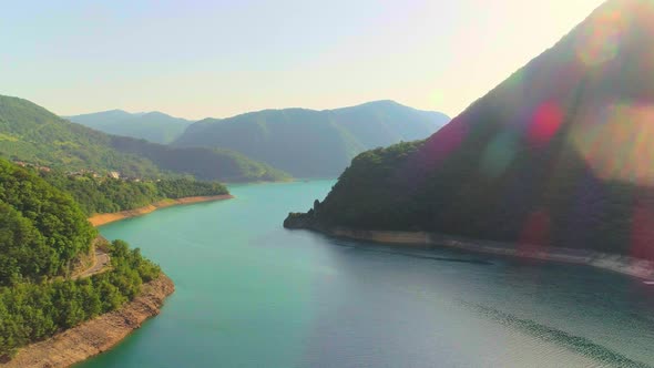 Aerial Video of Mountain Piva Lake and Mountains at Sunset alt