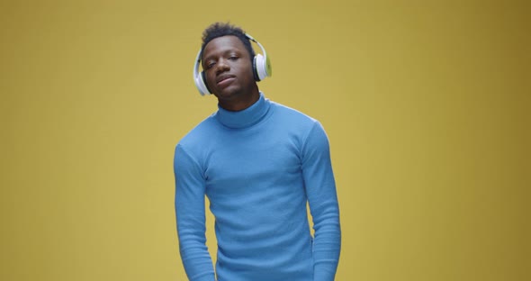 Young Man Enjoying Music alt