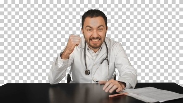 Smiling male doctor at medical office, Alpha Channel