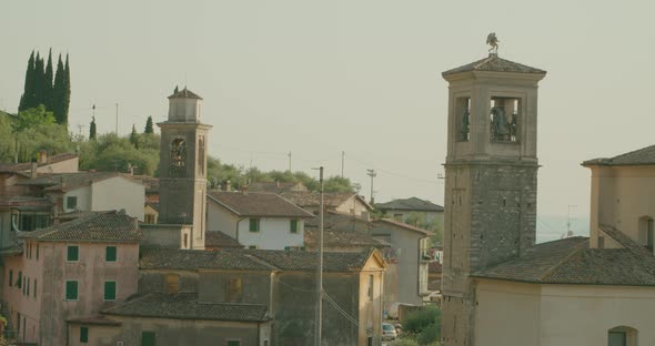 Full shot, Scenic view of Stone, brick village of Malcesine in Italy next to the Garda Lake. alt