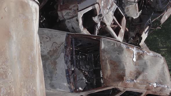 Vertical Video of a Dump of Destroyed Cars During the War in Ukraine alt