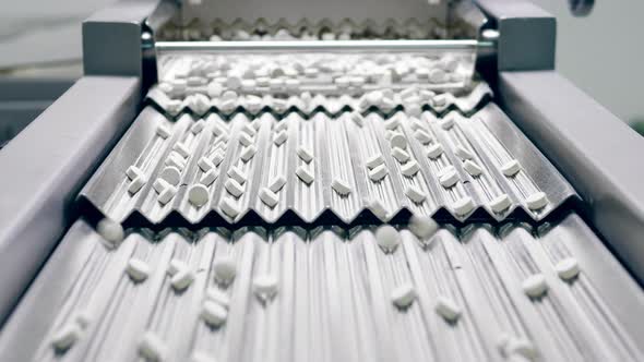 Stepped Conveyor with Drugs Getting Transported By It alt