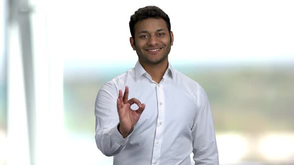 Cheerful Indian Businessman Showing OK Sign. alt