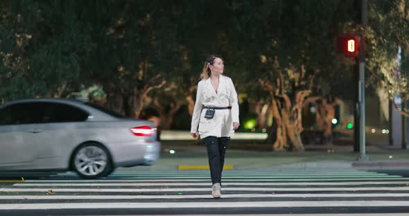 Confident Stylish Blonde Model Walks Catwalk on Night Urban Street Background alt