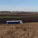 Truck Moves on Dirt Road on Corn Field Background - VideoHive Item for Sale