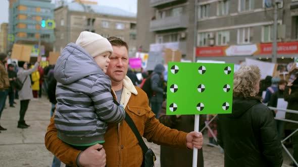 Protesting Family of Father and Kid Single Dad and Child at Political Picket