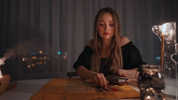 Woman Reading Tarot Cards in Spiritual Room alt