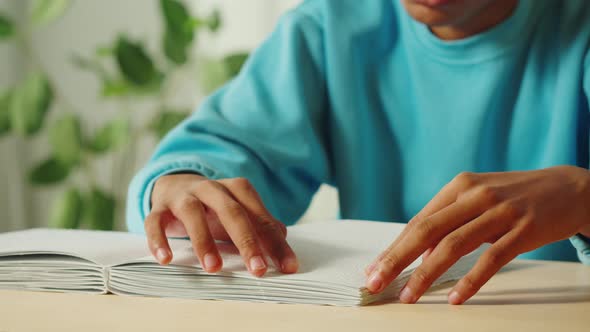 African American Man Reading Braille Book Closeup alt