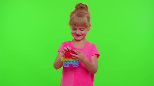 Child Girl Playing Squishy Silicone Bubbles Sensory Toy Simple Dimple Pop It Game Green Chroma Key alt
