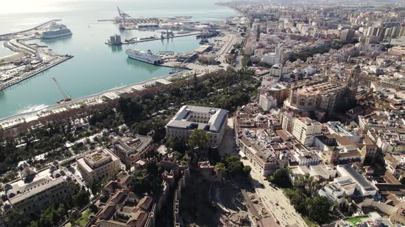 Malaga city center with port in background, Spain. Aerial drone view