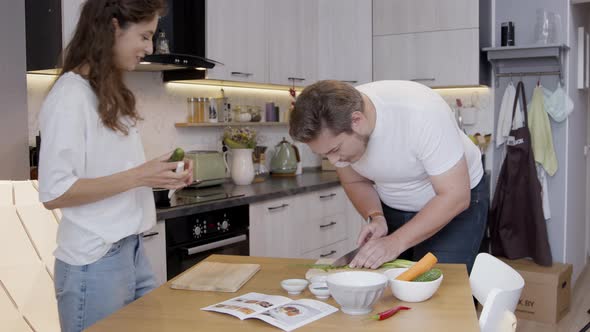 Beautiful Family Couple Have Fun Cooking Romantic Dinner Together Cut Vegetables