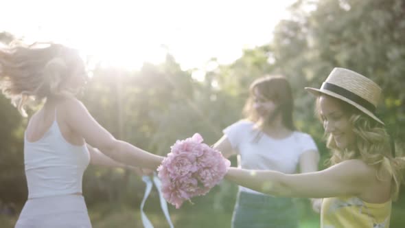 Three Happy Smiling Girls Dancing in the Circle alt