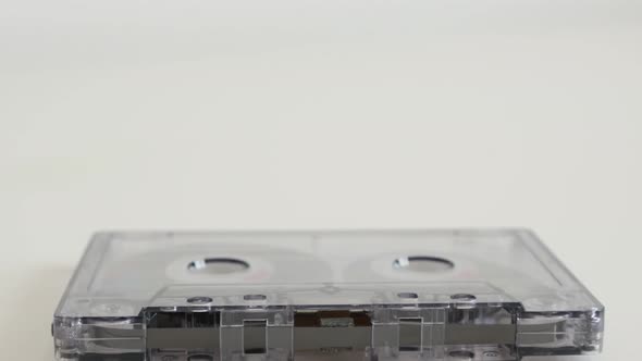 Transparent analogue retro magnetic tape 4K 2160p 30fps UltraHD tilting footage - Compact audio cass