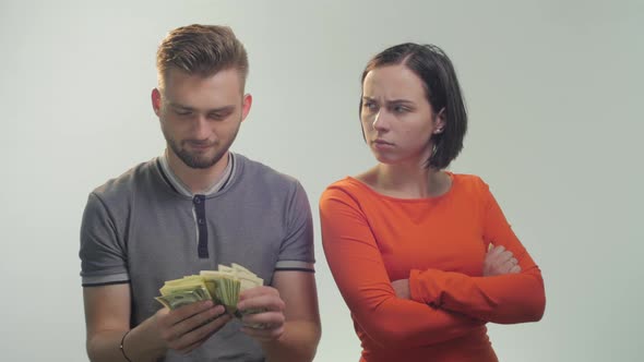 Upset woman near a happy man alt