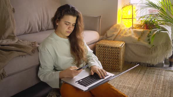 Professional Freelancer with Loose Hair Types on Smartphone